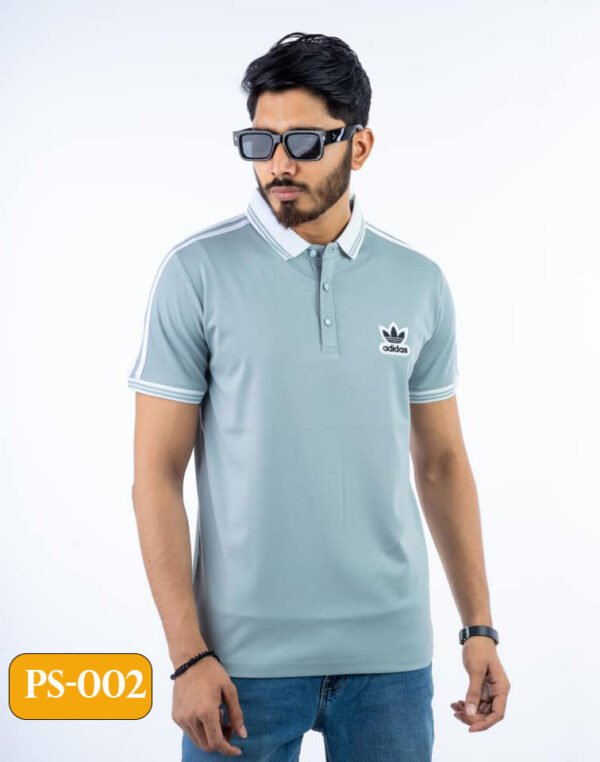 Adidas embroidered polo shirt in a classic design, featuring the iconic logo on the chest and crafted from premium cotton for ultimate comfort.